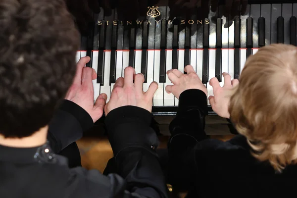 A festive concert. Piano from two to eight hands